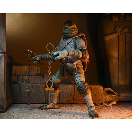 Universal Monsters x Teenage Mutant Ninja Turtles - 7" Scale Action Figure - Ultimate Michelangelo as The Mummy (THIS IS A PREORDER)